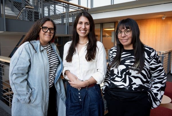 three women posing for a portrait