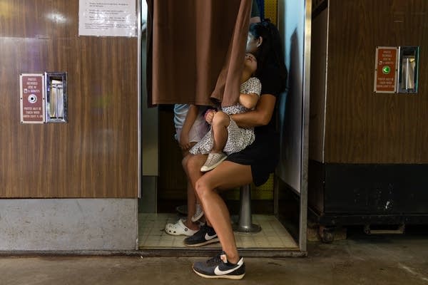 family taking photo in vintage booth