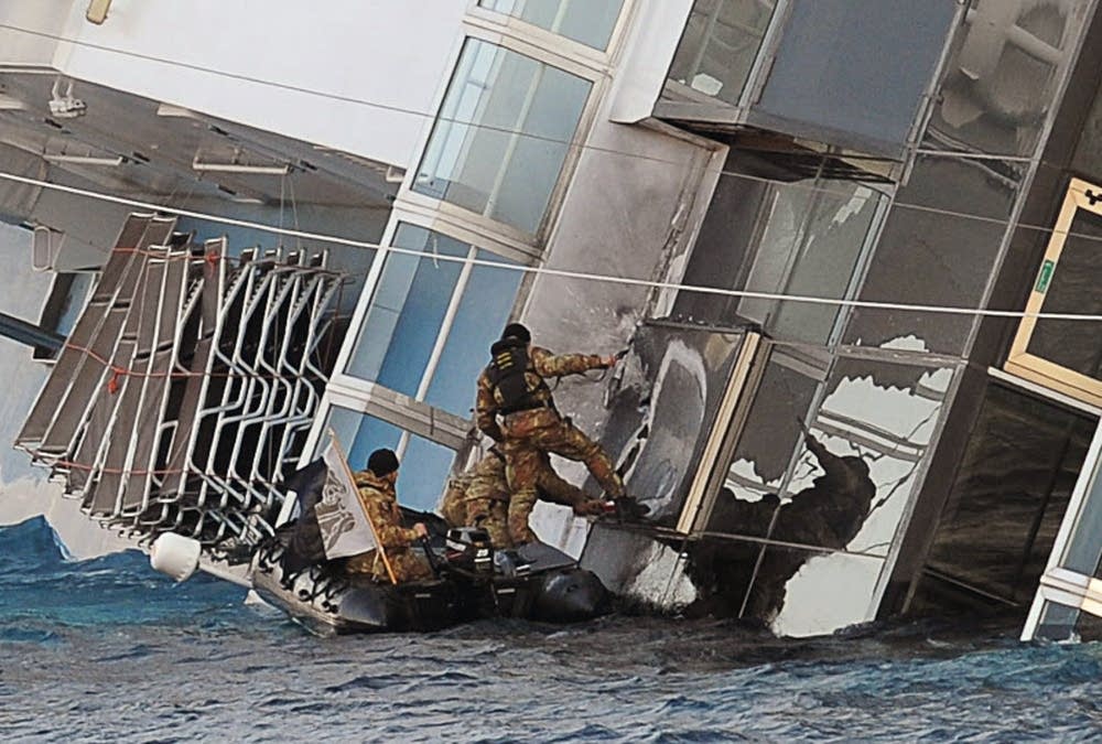 Rescuers place explosive charges