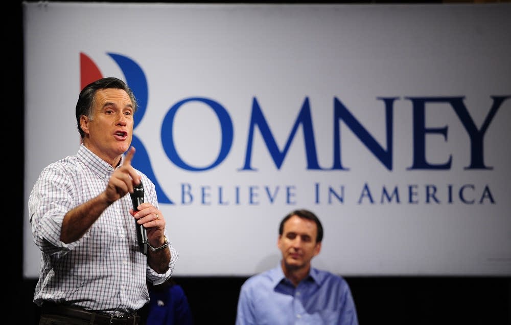 Pawlenty in the background