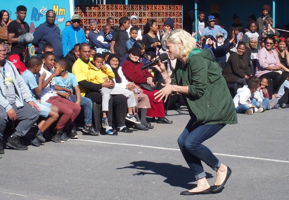 Dessa performing at a school in South Africa