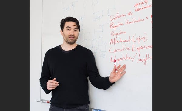 Photo of Kirk Honda teaching in front of white board