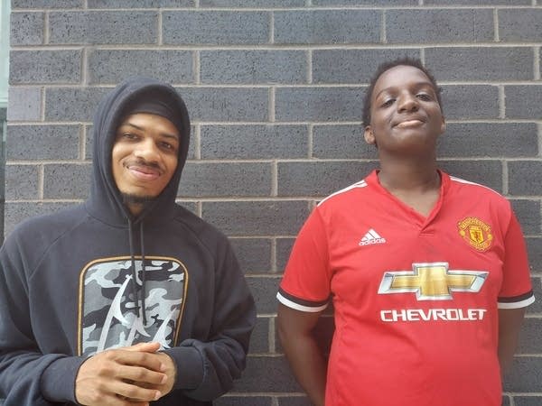 Two people pose in a photograph.