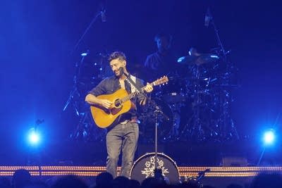 Mumford & Sons performing on stage