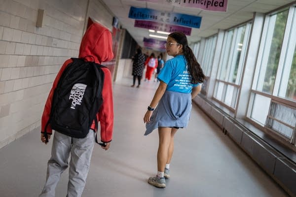 Two students walk together
