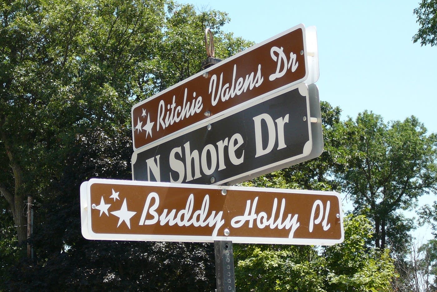 signpost in Clear Lake, Iowa, at the corner of Ritchie Valens Drive and Buddy Holly Place