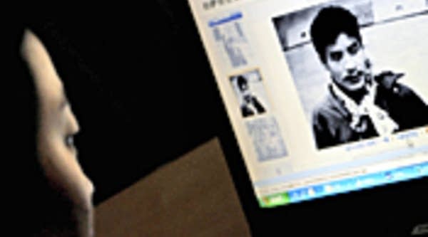 An Internet user reads the Yahoo website in Beijing, which contains a list and photos of what the Chinese government called "The 19 most-wanted Lhasa rioters", vowing to punish those responsible for last week's violence in the Tibetan capital of  Lhasa.