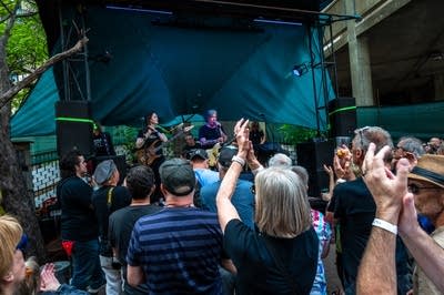 a band performing on an outdoor stage