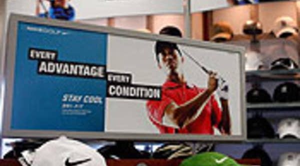 A Nike Golf display featuring Tiger Woods is shown at a golf shop in Orlando, Fla.