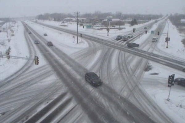Light snow this afternoon, slick roads into evening