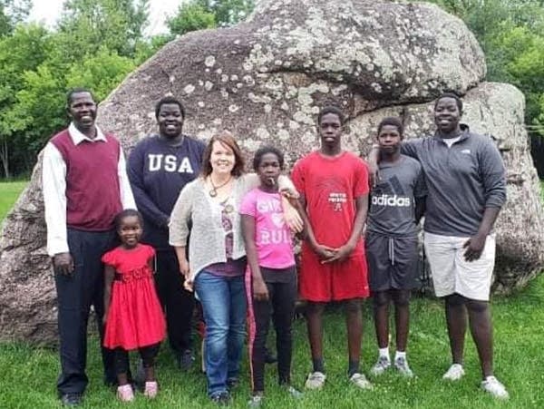 Chol Okey Opiew (left) and his children