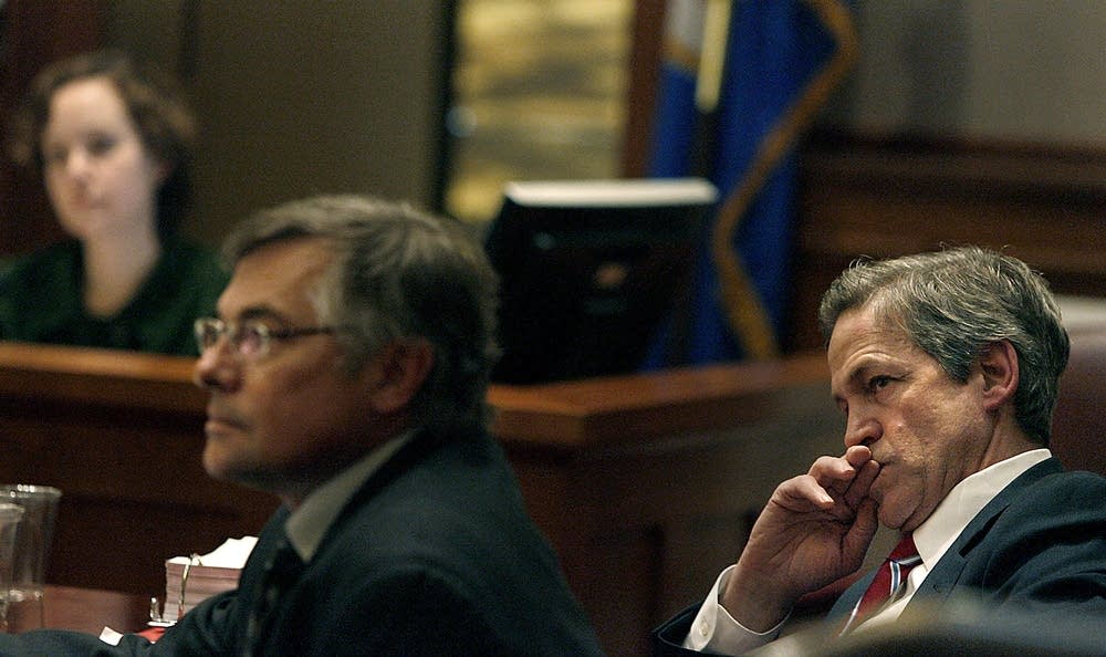Norm Coleman listens in court