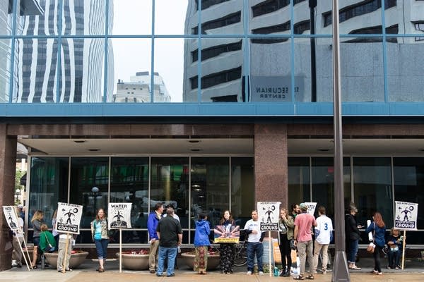 Citizens wait to enter the Public Utilities Commission.