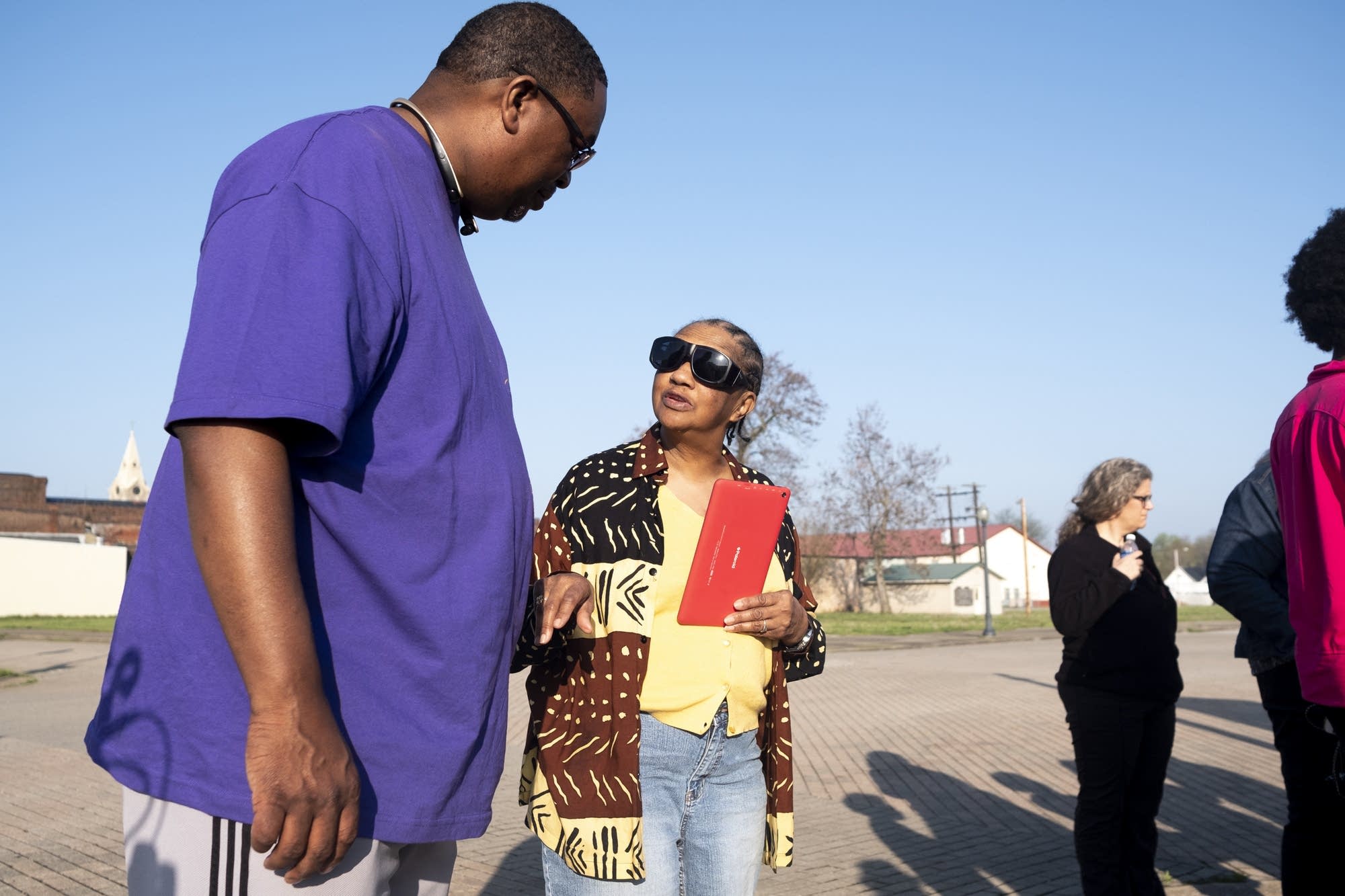Carl Crawford speaks with Portia Johnson on the site of a lynching.