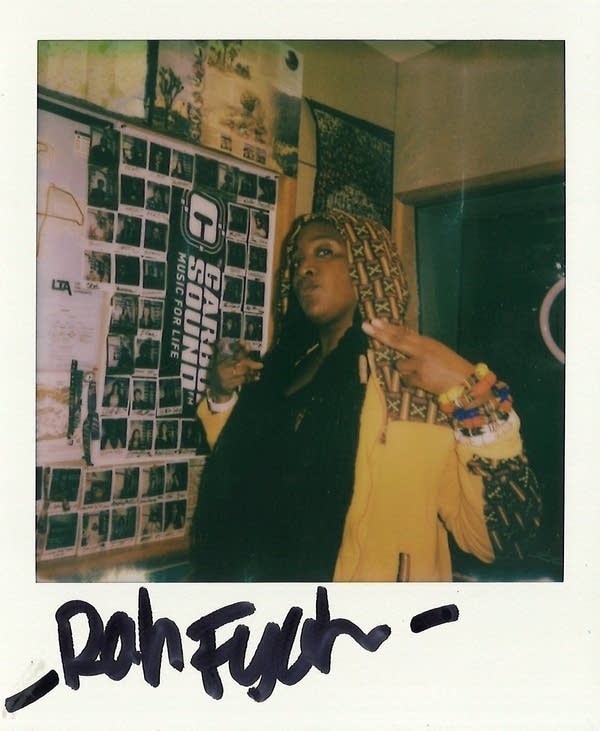 a signed polaroid with a woman in it