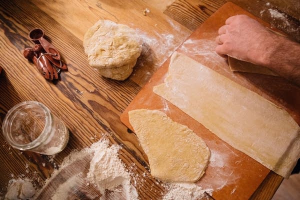 Ramen dough is laid across the counter.