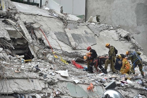 Israeli rescuers search for survivors.