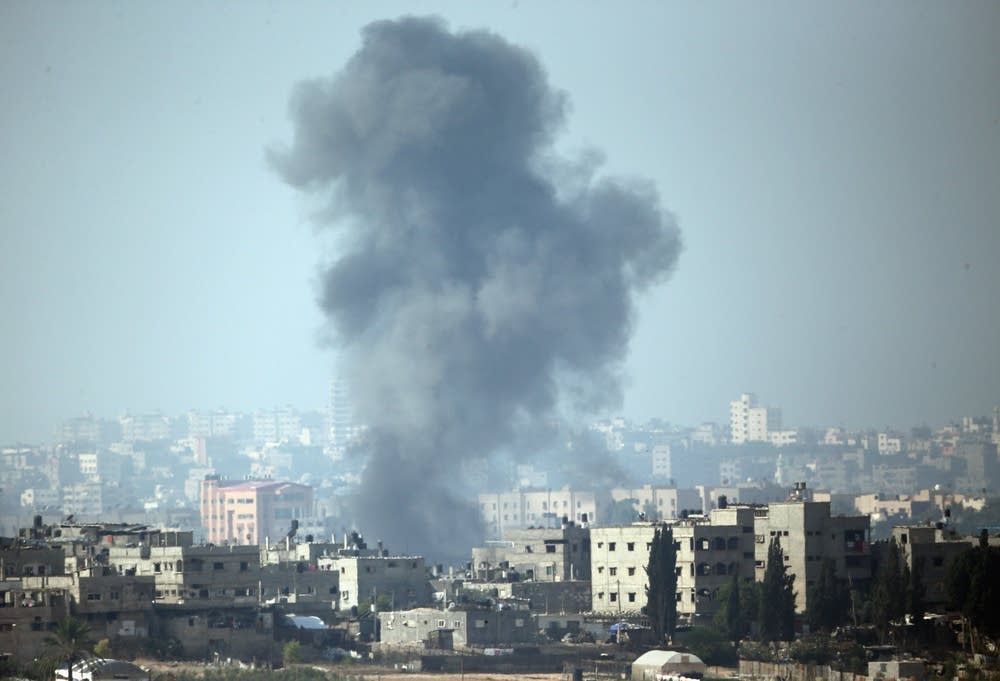 A plume of smoke rises above Gaza City