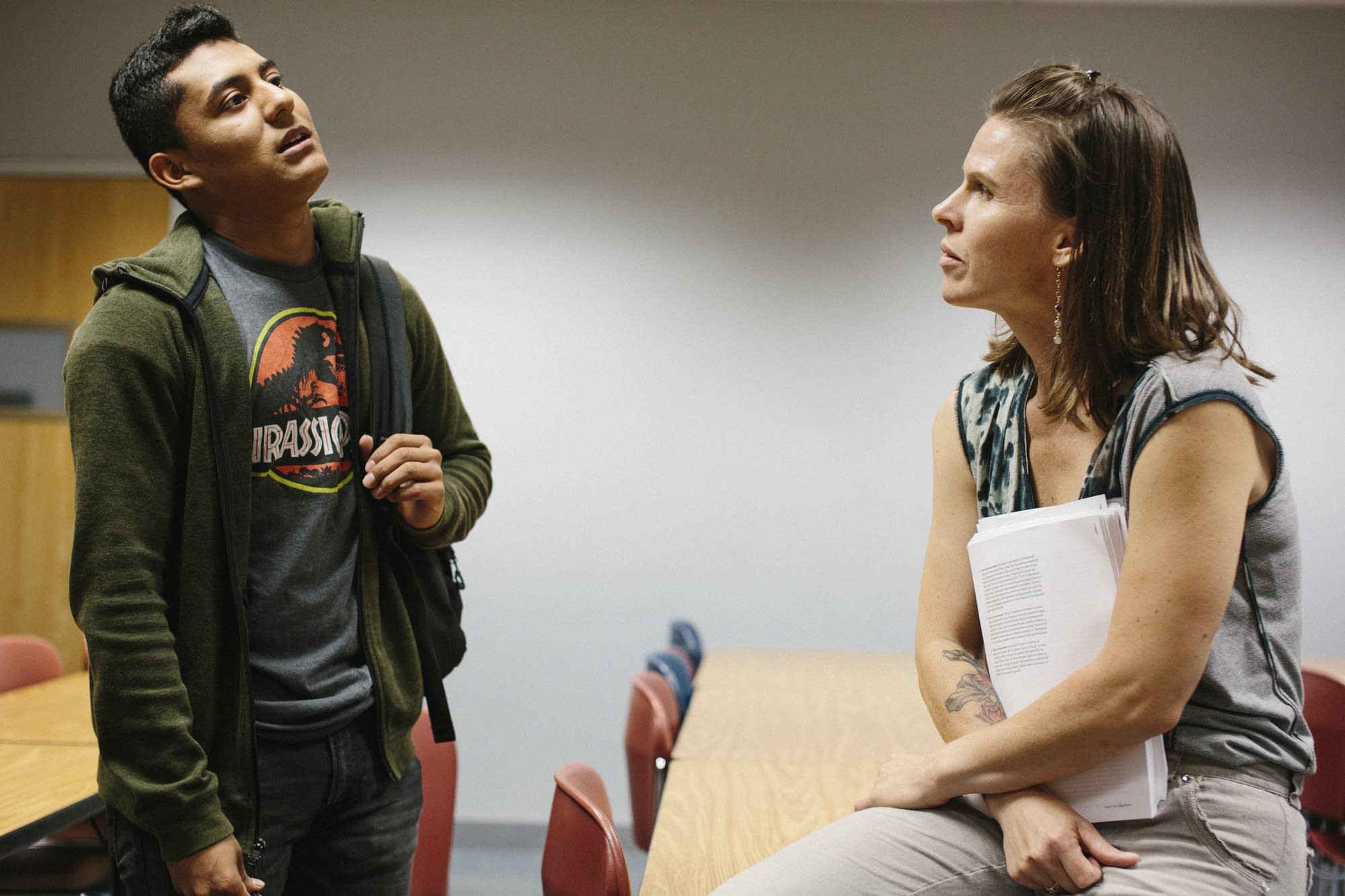 Yossiman Bautista talks with teacher Elizabeth Fontaine.
