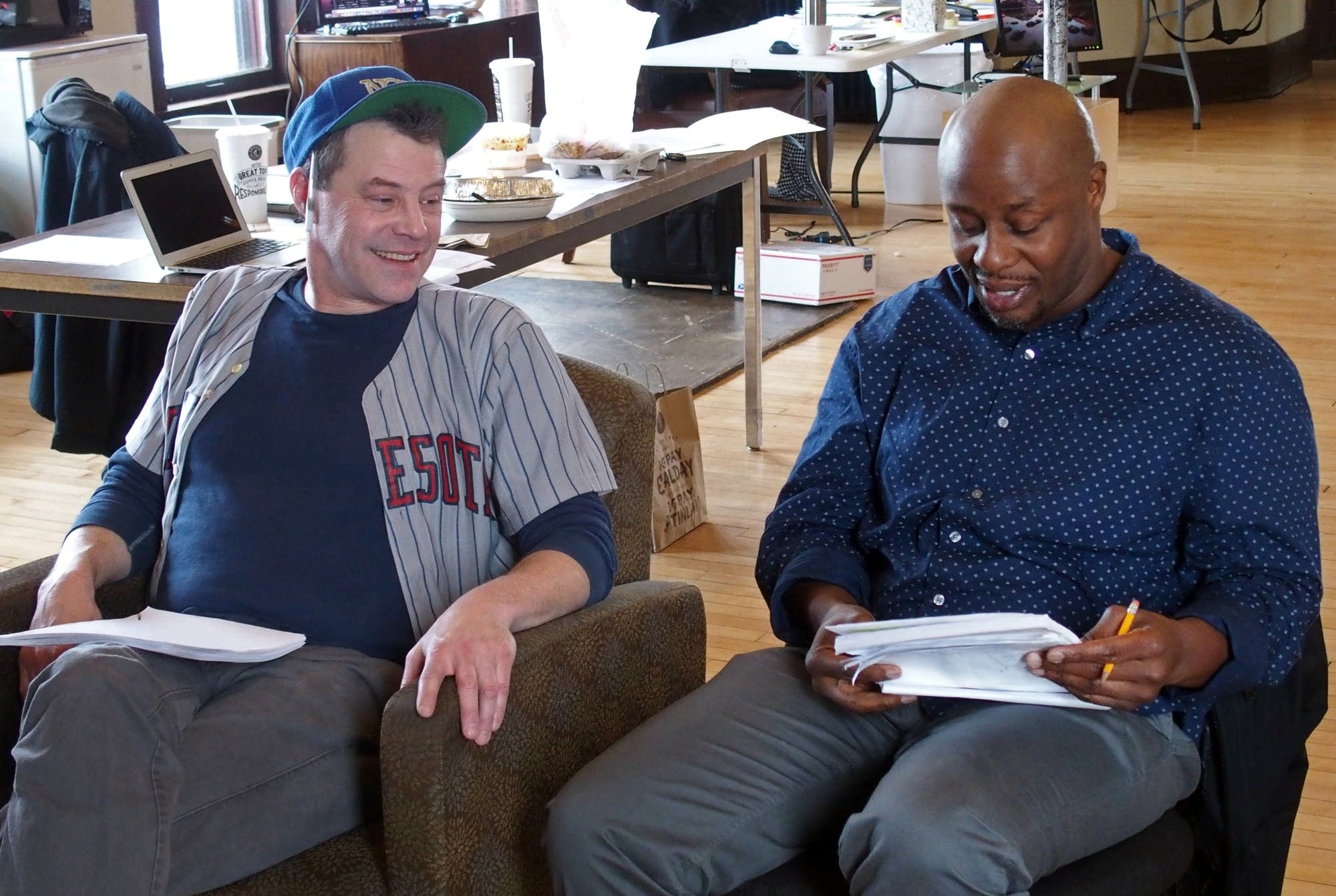 Actors Michael Lee, left, and Ansa Akyea read through a scene.
