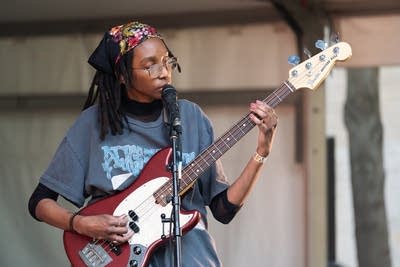 the band oeurth performing on stage outdoors