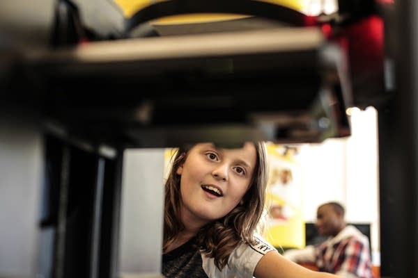 Sophia Greiner is fascinated by the 3-D printer.