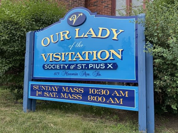 A photo of the sign and exterior of a brick church
