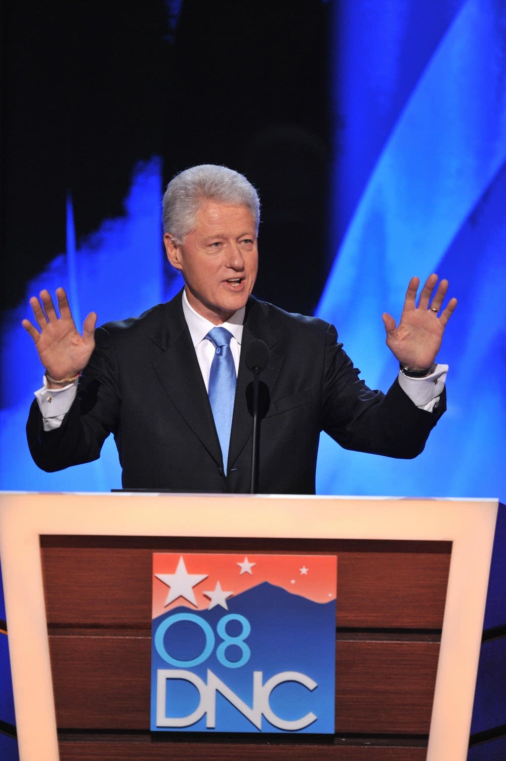 Former U.S. president Bill Clinton takes the stage