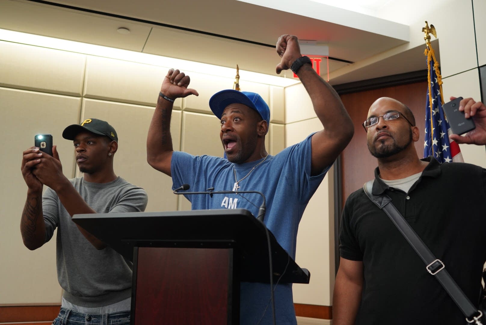 John Thompson, a friend of Philando Castile's, speaks at the podium.
