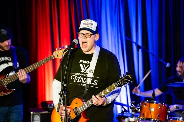 Man singing into microphone