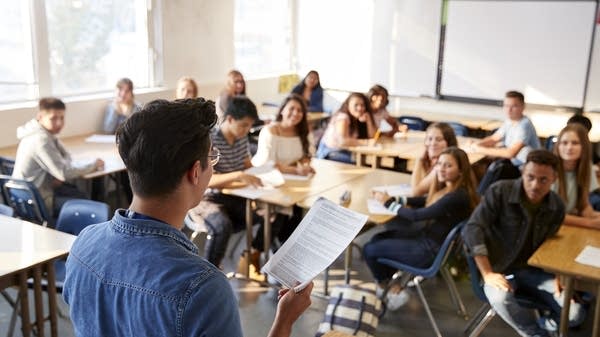 teacher speaks to a classroom