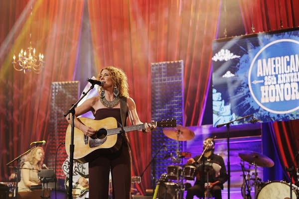 A band performing onstage