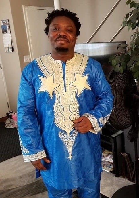 man in Blue Ghanian shirt