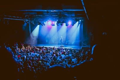 Band performing on stage and crowd