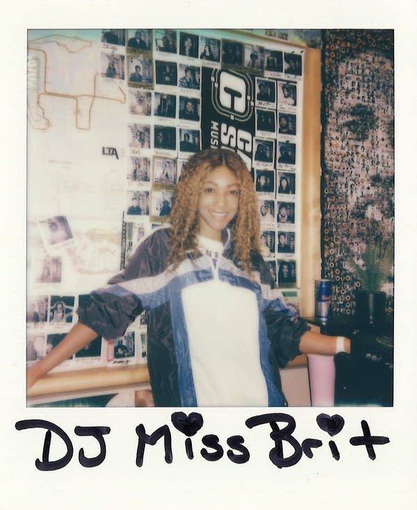 DJ Miss Brit posing for a polaroid photo
