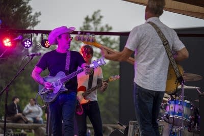 the band the honeydogs performing on an outdoor stage