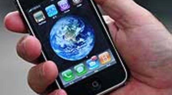 A man displays his iPhone