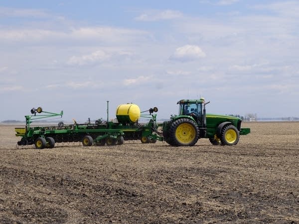 Seventy-year-old John Jensen plants canola