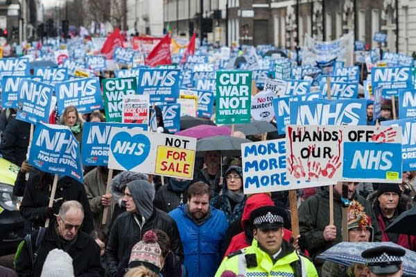 Thousands of people take part in a march through central London in 2018 to protest against underfunding and privatisation of the NHS. (Wiktor Szymanowicz / Barcroft Media via Getty Images)