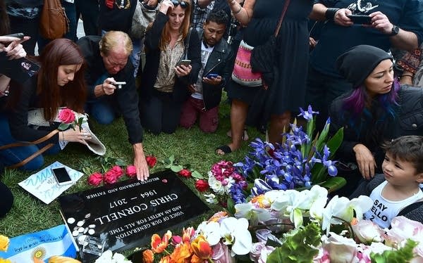 Fans visit the grave of Chris Cornell at Hollywood Forever Cemetery