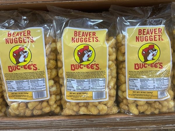 A row of Buc-ee's beaver nuggets in plastic packaging