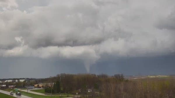 An apparent tornado is seen in the distance