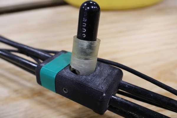 A device sits on a workshop table.