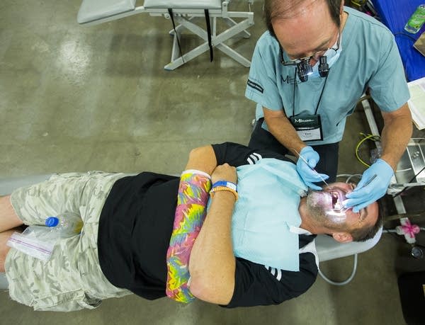 Dentist Tim Smith worked on David Moore's teeth.