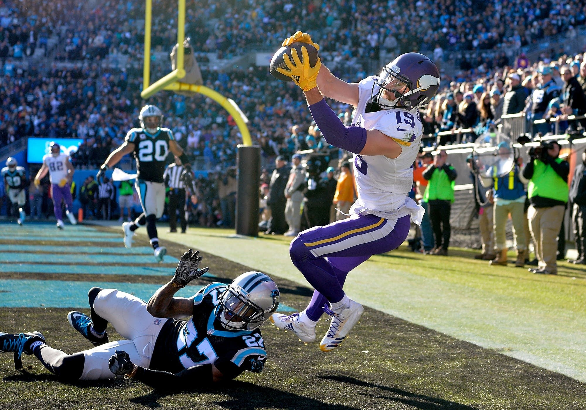 Adam Thielen attempts a catch against the Panthers Kevon Seymour.