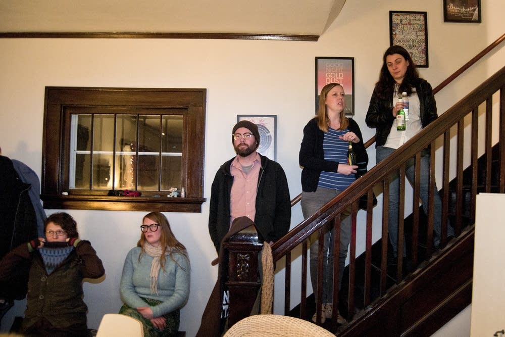 Home concert attendees line the staircase.