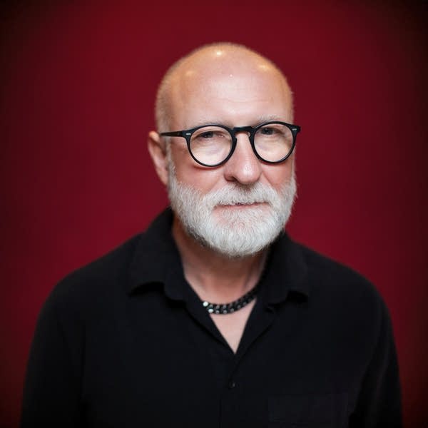 Bob Mould wears a black shirt.