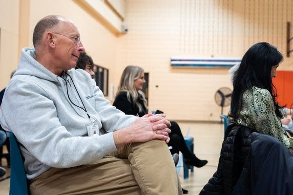 Paul Schnell watches a performance by the Black Storytellers Alliance.