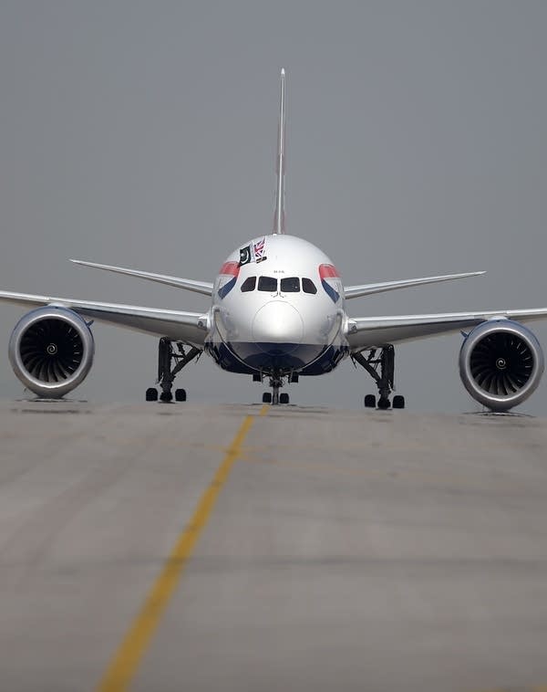 A British Airways aircraft taxies on a runway with the Pakistani and Union Jack flags upon landing at the Islamabad International Airport (Photo AAMIR QURESHI/AFP/Getty Images)