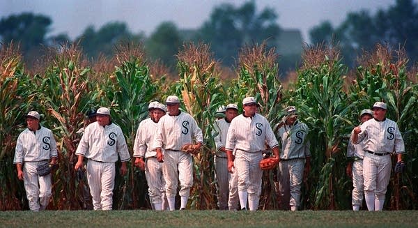 People walk out of a cornfield